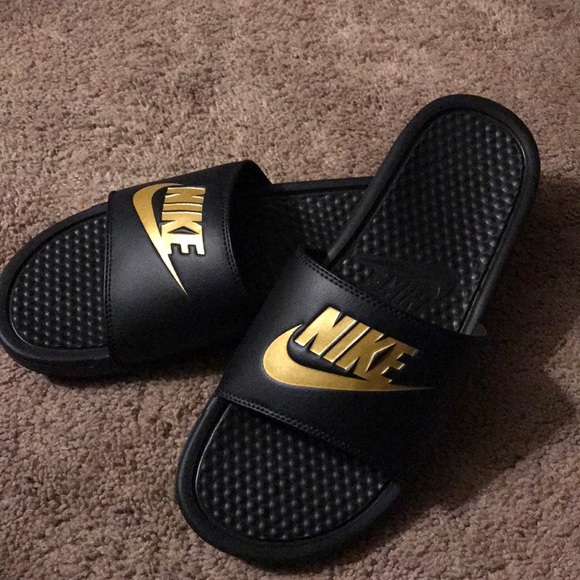 nike black and gold sliders